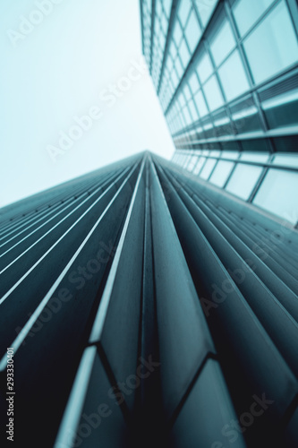 Abstract view of lines of a modern skyscraper building. look up view into a grey sky. Frankfurt am Main in Germany