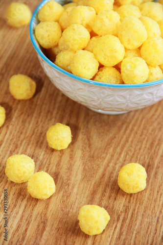 round yellow natural corn balls for breakfast in a ceramic a plate
