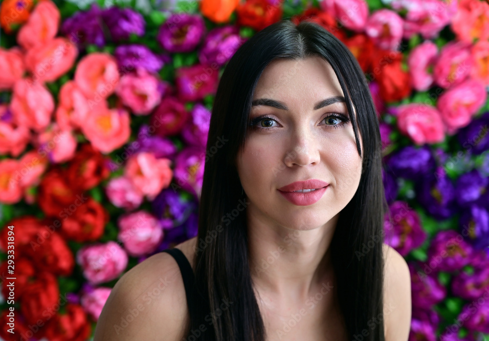 Close-up Portrait of a pretty girl with good makeup brunette with long hair on a colored background. Great makeup, beautiful face. Close-up Portrait of a pretty girl with good makeup brunette with long hair on a colored background. Great makeup, beautiful face.