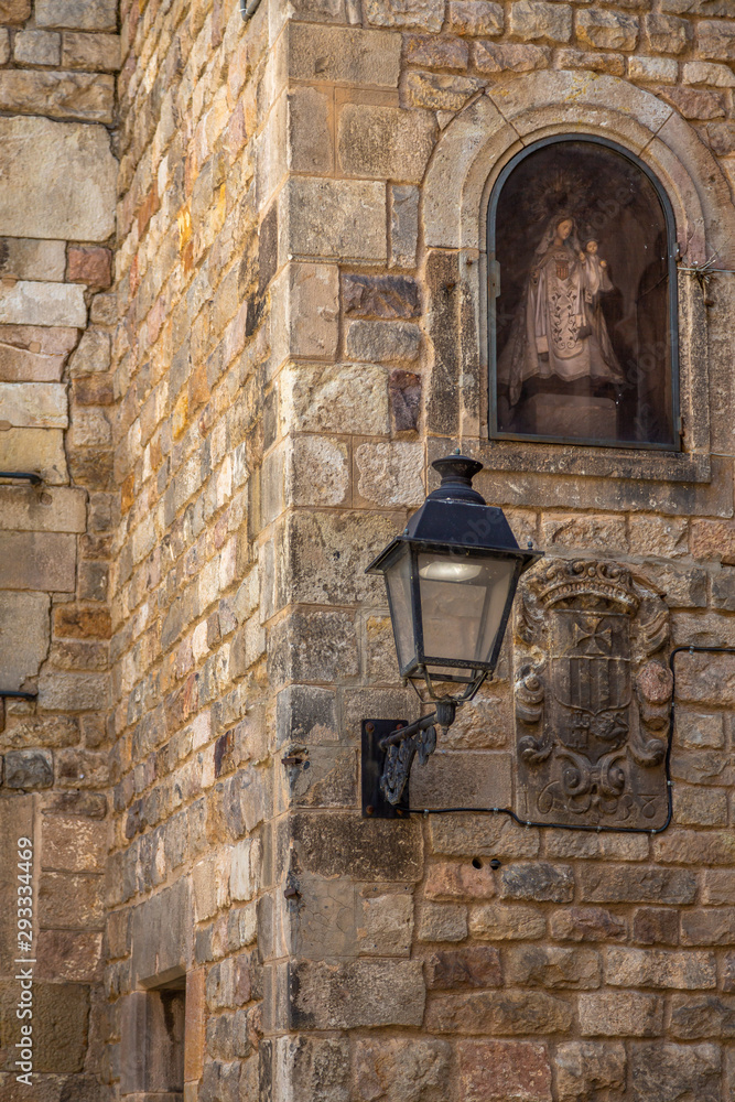 Building detail in the Gothic Quarter, Barcelona. Barrio Gótico, Spanish for 'Gothic Quarter,' is the oldest and most beautiful area in Barcelona with the labyrinth of small streets and historic build Building detail in the Gothic Quarter, Barcelona. Barrio Gótico, Spanish for 'Gothic Quarter,' is the oldest and most beautiful area in Barcelona with the labyrinth of small streets and historic build