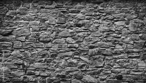 Very old gray natural stone wall