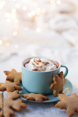 Slika na platnu Hot winter drink: chocolate with whipped cream in blue mug