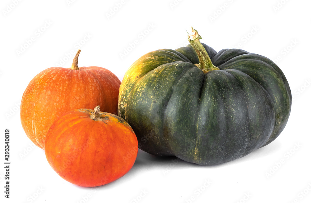 three green, red and yellow pumpkin isolated on white background. autumn harvest creative concept three green, red and yellow pumpkin isolated on white background. autumn harvest creative concept