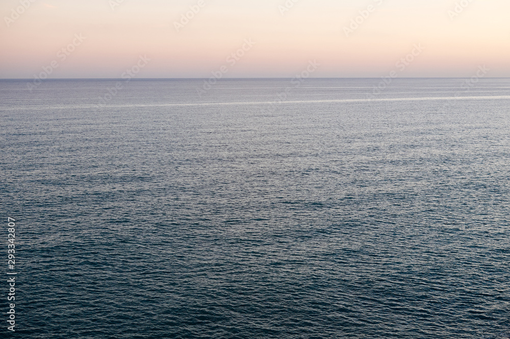 Obraz premium Mediterranean sea background at sunset