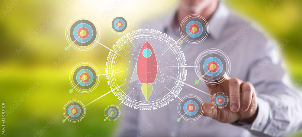 Fototapeta premium Man touching a business target concept