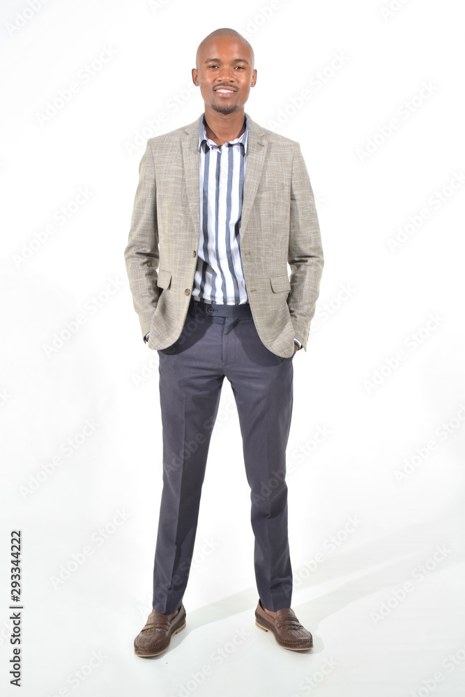 portrait of a handsome man in suit with hands on pockets portrait of a handsome man in suit with hands on pockets