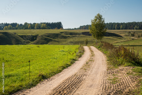 Road in Suwalski Landscape Park at autmn, Podlaskie, Poland photo