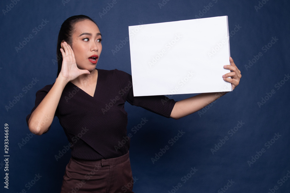Young Asian woman surprise with white blank sign. Young Asian woman surprise with white blank sign.