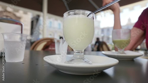 Quenching lemon granita in a bar in the historic center of Catania, Sicily Italy.