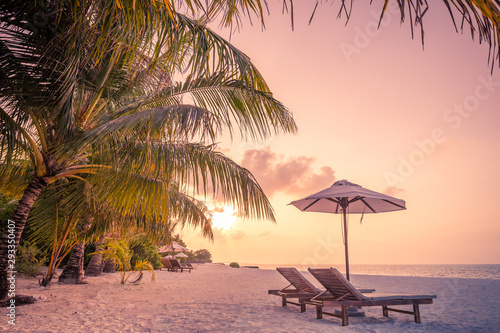 Sunset landscape on tropical beach. Luxury vacation or holiday concept, resort or hotel. 