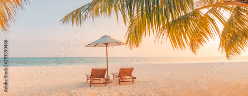 Beautiful tropical beach banner. White sand and coco palms travel tourism wide panorama background concept. Amazing beach landscape. Chairs on the sandy beach near the sea. Summer vacation concept