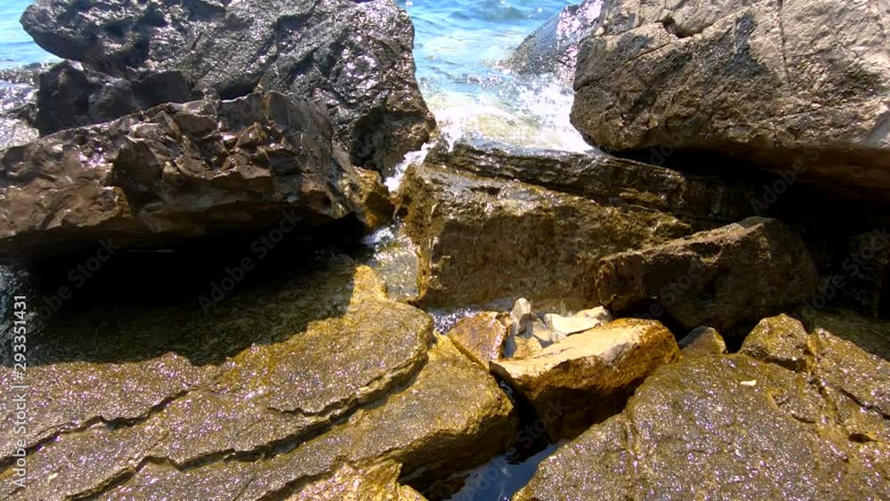Slow motion ascend tilt up tidal waves hitting rock sharp shore Slow motion ascend tilt up tidal waves hitting rock sharp shore