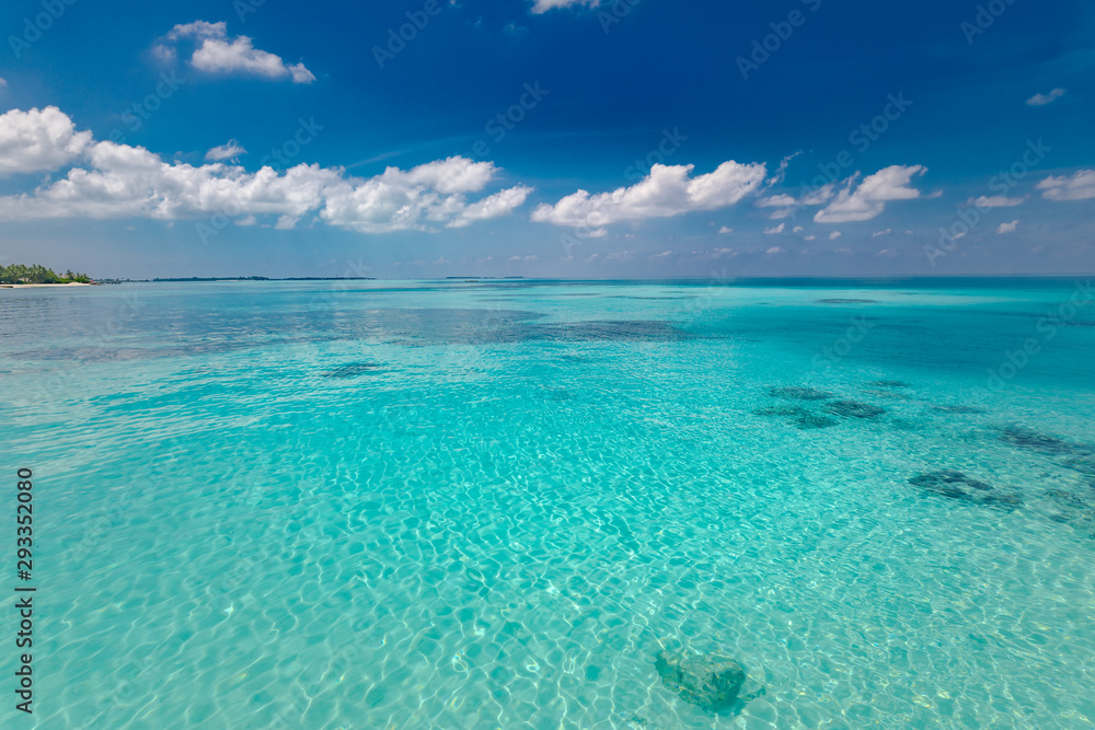 Ocean and sky. Tropical nature pattern, azure green sea water under blue sky