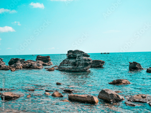 Beautiful ocean view with rocks and cyan blue sky in VIetnam