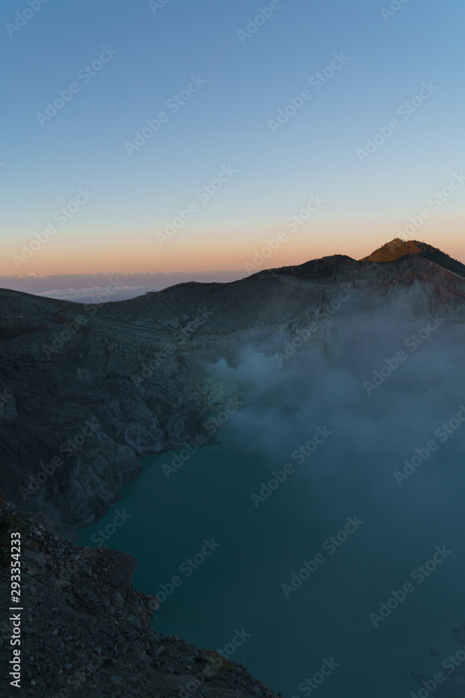 First light with fog. Sunrise on on the mountain  Ijen  Java ,Indonesia.