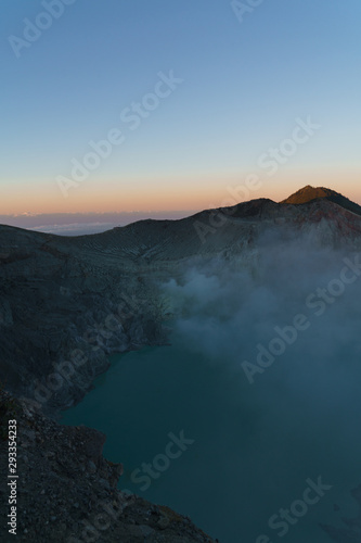 First light with fog. Sunrise on on the mountain Ijen Java ,Indonesia.