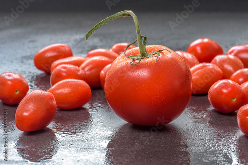 red tomatoes on dark surface