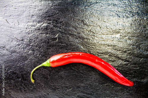 red hot pepper with black background