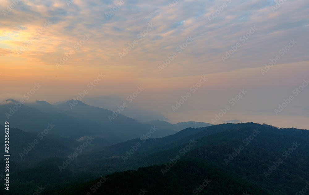 View of the morning mountain scenery that twilight light hits. Causing to see the mountains overlapping into beautiful layers