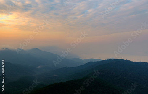 View of the morning mountain scenery that twilight light hits. Causing to see the mountains overlapping into beautiful layers © Wuttichai