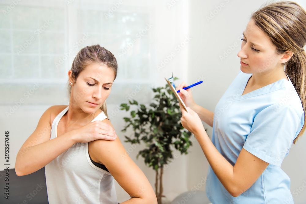A Modern rehabilitation physiotherapist at work with client A Modern rehabilitation physiotherapist at work with client