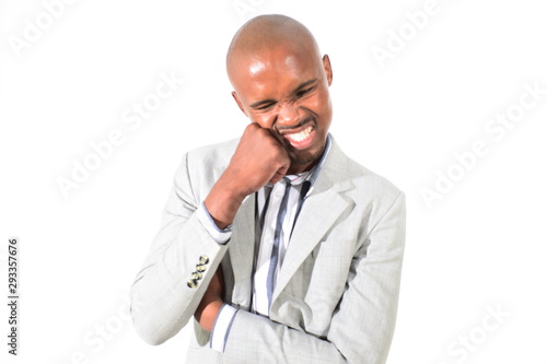 handsome young businessman frustrated with hes hand on chin angry