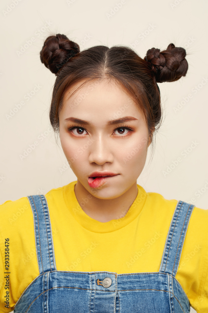 Close up photo beautiful amazing she her lady two hair buns bite lip oh no  sorry guilty despair expression wear a jeans dungaree foto de Stock | Adobe  Stock