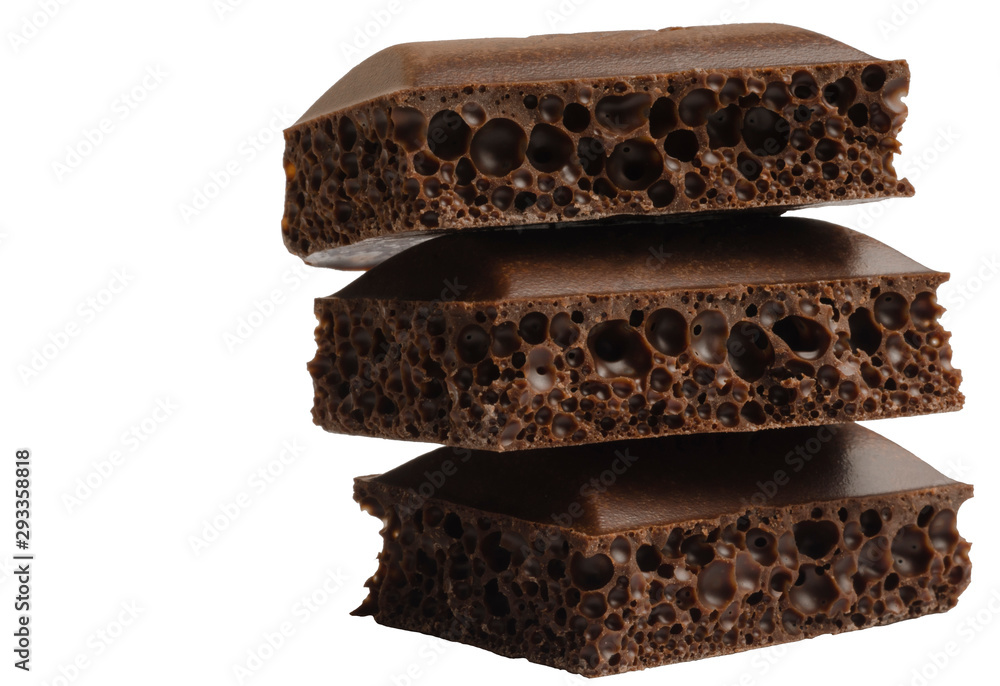 Three pieces of porous chocolate on a white background Three pieces of porous chocolate on a white background