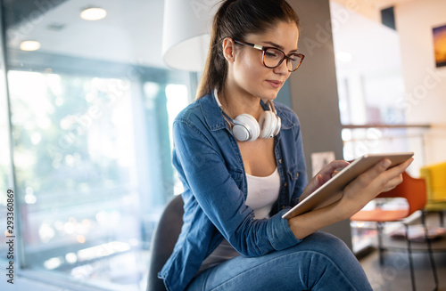 Beautiful student girl learning in a library Free Download Beautiful student girl learning in a library - GFXLoad