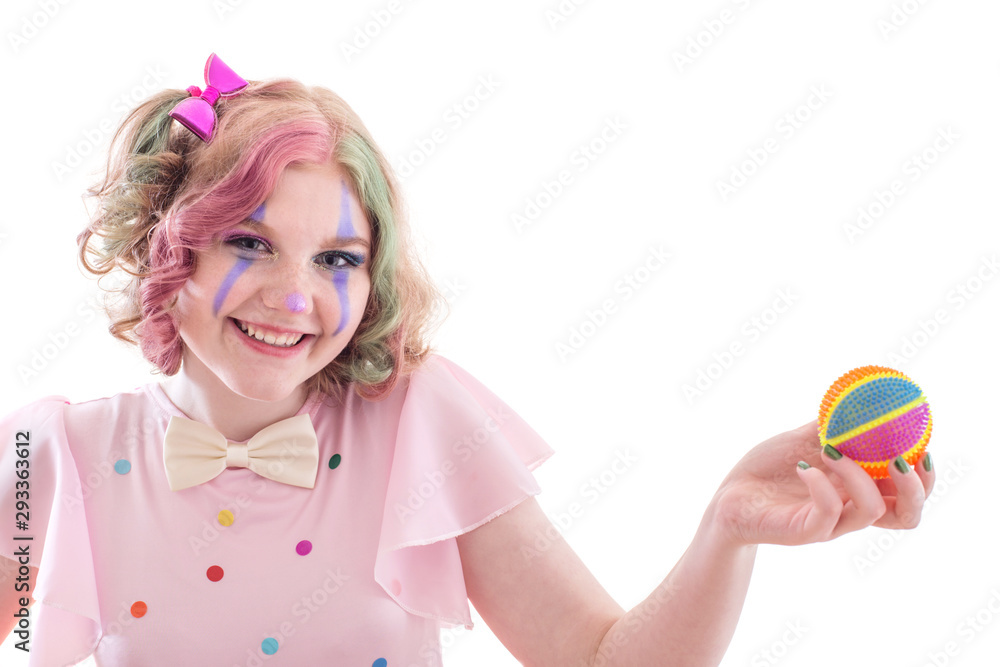 Φωτογραφία smile teenager girl in clown costume with ball  isolated on white background
