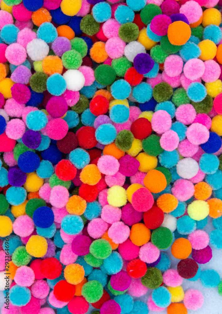 A colorful  Pom Pom background with white space