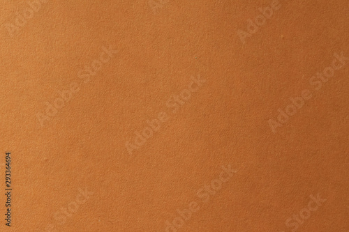 Clean orange paper texture. High resolution photo. Color paper, yellow paper. Empty orange paper backgrounds.