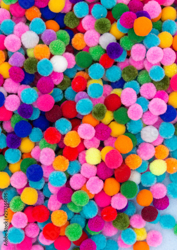 A colorful Pom Pom background with white space