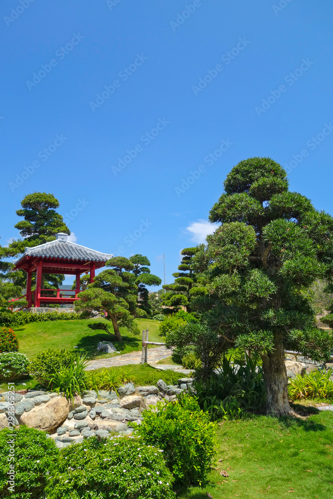 Japanese garden with red pagoda, beatiful landscape and blue sky in dendra park in Vietnam