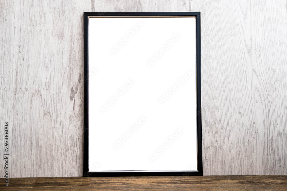 Black mockup frame on rustic wooden background Black mockup frame on rustic wooden background