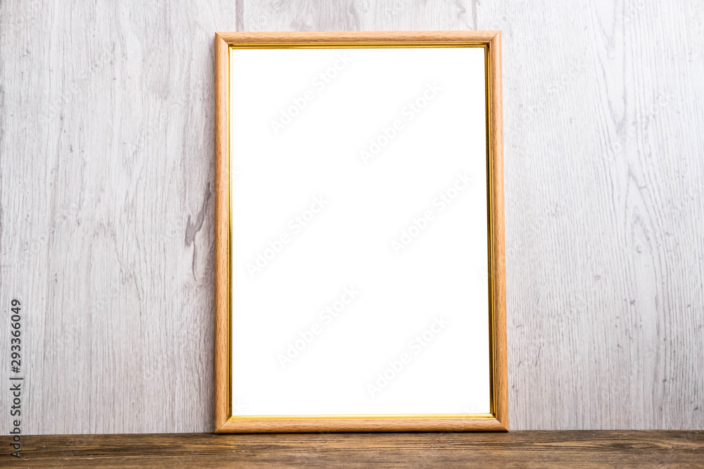 Brown A4 mockup frame on rustic wooden background Brown A4 mockup frame on rustic wooden background