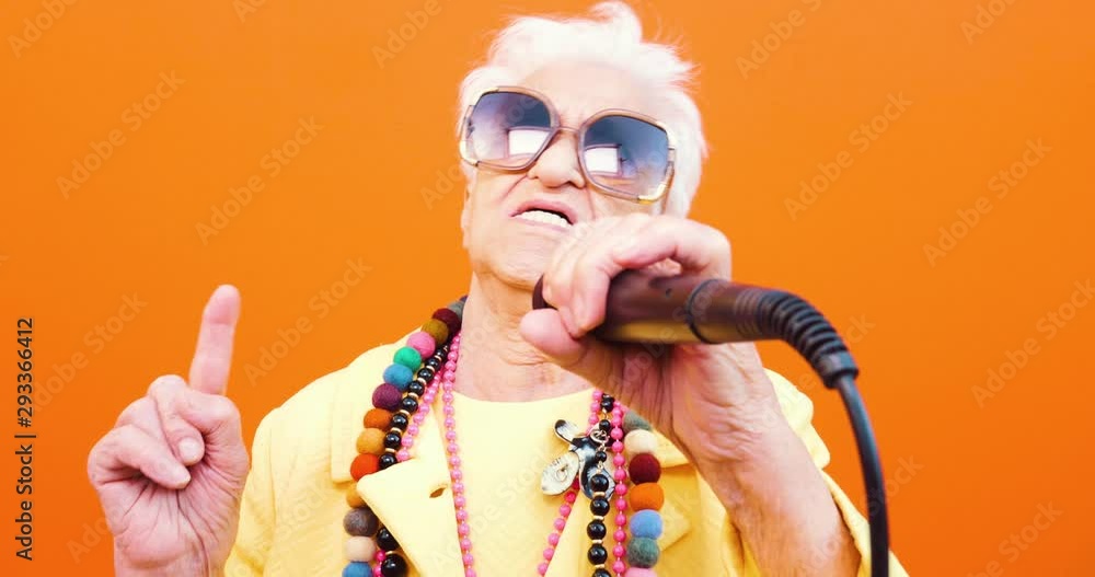 Funny grandmother portraits. Senior old woman dressing elegant for a special event. Rockstar granny on colored backgrounds