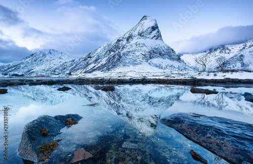 Mountains ridge and reflection on the water surface. Natural landscape in the...