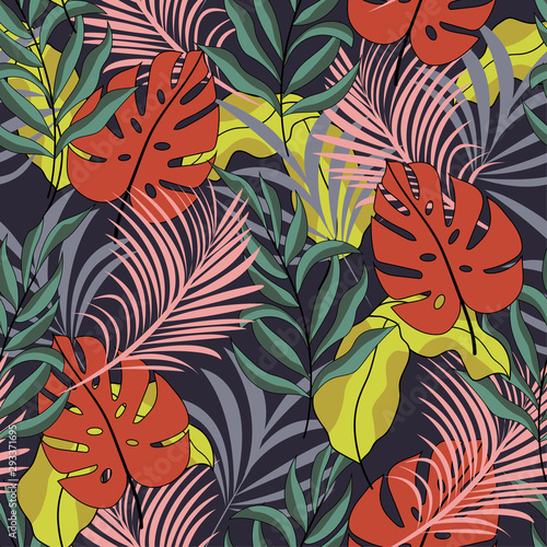 Tropical seamless pattern with bright red and green leaves and plants on dark background. Modern abstract design for fabric  paper  interior decor. Seamless exotic pattern with tropical plants. 