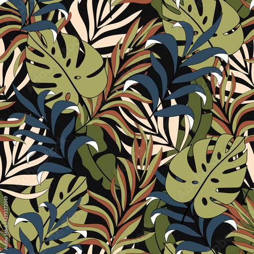 Abstract tropical seamless pattern with beautiful yellow and blue leaves and plants on a dark background. Modern abstract design for fabric, paper, interior decor. Beautiful seamless vector 