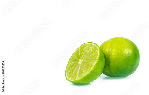 green lemon and slice isolated on white