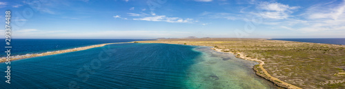 Aerial view of coast of Curaçao in the Caribbean Sea with turquoise water, cliff, beach and beautiful coral reef around Eastpoint