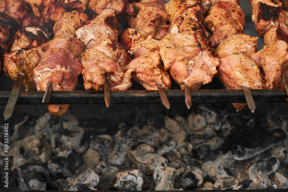 barbecue meat on skewers. grilled meat on open grill. street food barbecue meat on skewers. grilled meat on open grill. street food