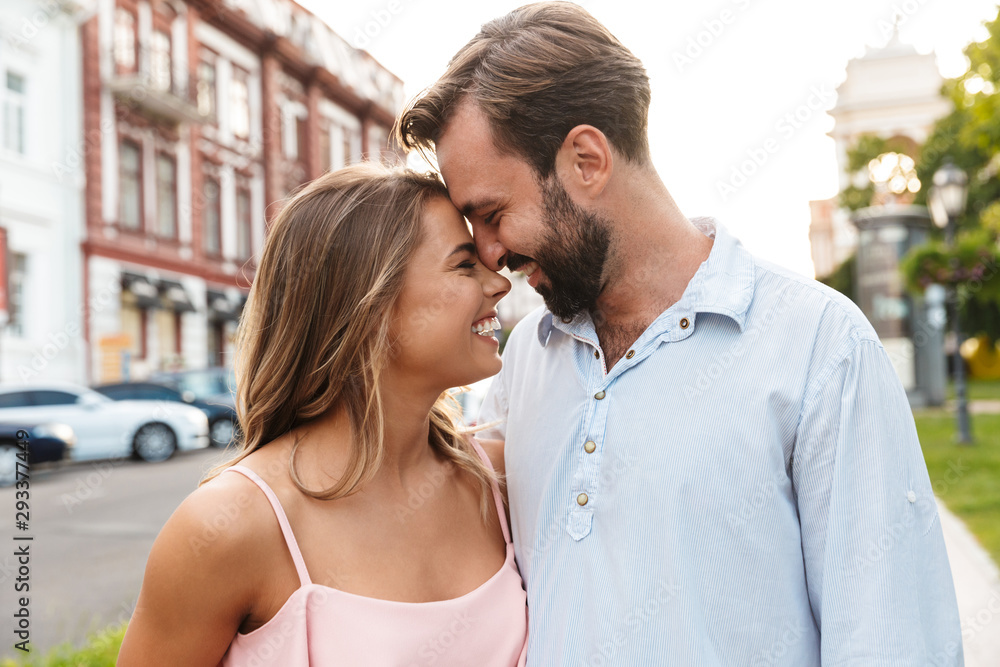 Close up of a happy beautiful couple embracing Close up of a happy beautiful couple embracing