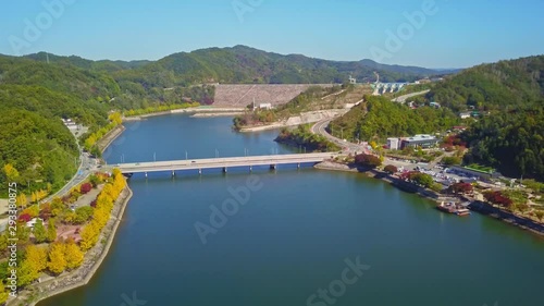 Aerial video of Wolyeonggyo bridge is located in the midst of Nakdong river in the morning during Autumn season at Andong city, South Korea. photo