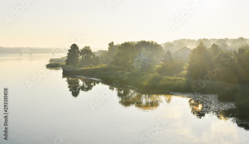 Summer morning on the Lielupe river in Jurmala, Latvia. Fog. Sunrise. © Pavels