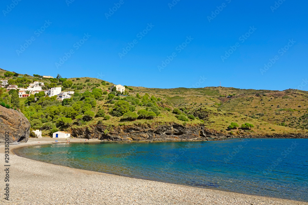 Beach on the Mediterranean Sea among the green slopes