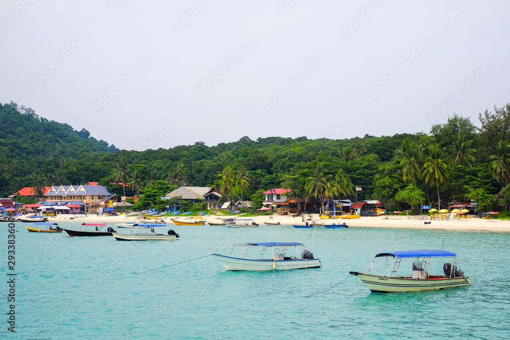 Pulau Perhentian, Terengganu - August 14th, 2018 : Beautiful view of small Perhentian Island with multiple boats. Perhentian Island is the most favourite holiday destination among locals and tourists Pulau Perhentian, Terengganu - August 14th, 2018 : Beautiful view of small Perhentian Island with multiple boats. Perhentian Island is the most favourite holiday destination among locals and tourists