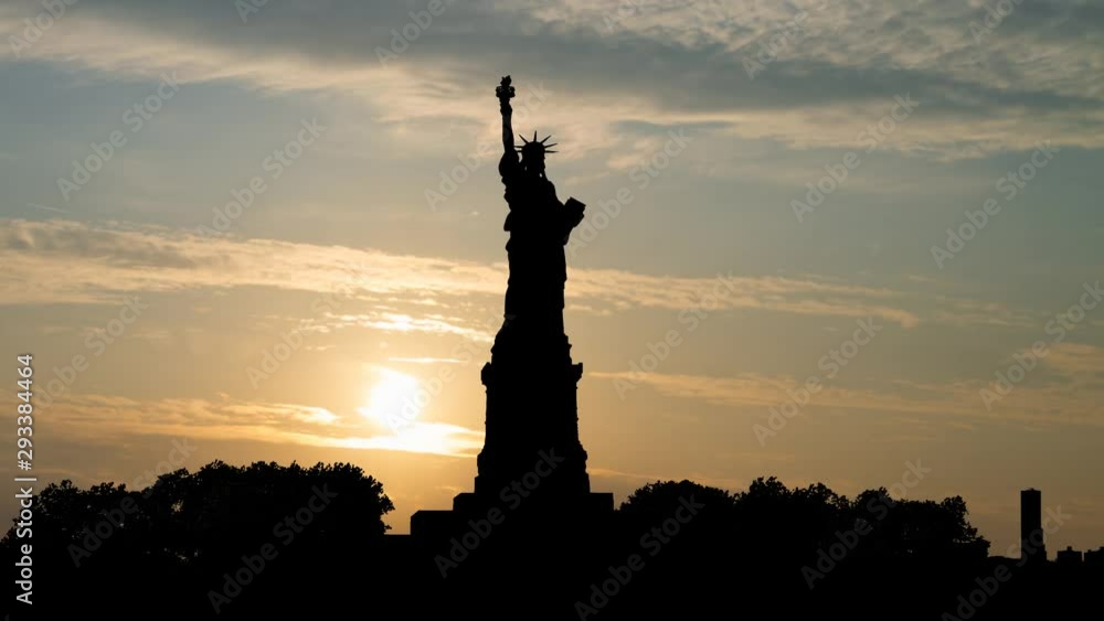 The Statue of Liberty in New York City, Time Lapse at Sunrise, Manhattan, New York, USA The Statue of Liberty in New York City, Time Lapse at Sunrise, Manhattan, New York, USA