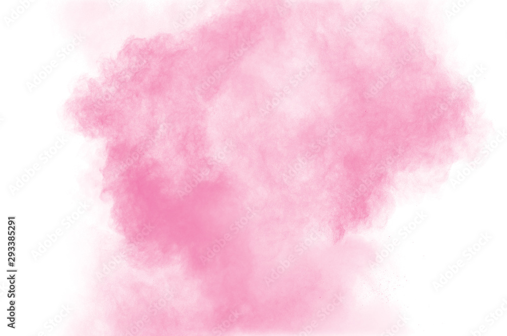 Abstract pink dust explosion. abstract pink powder splattered on white background.